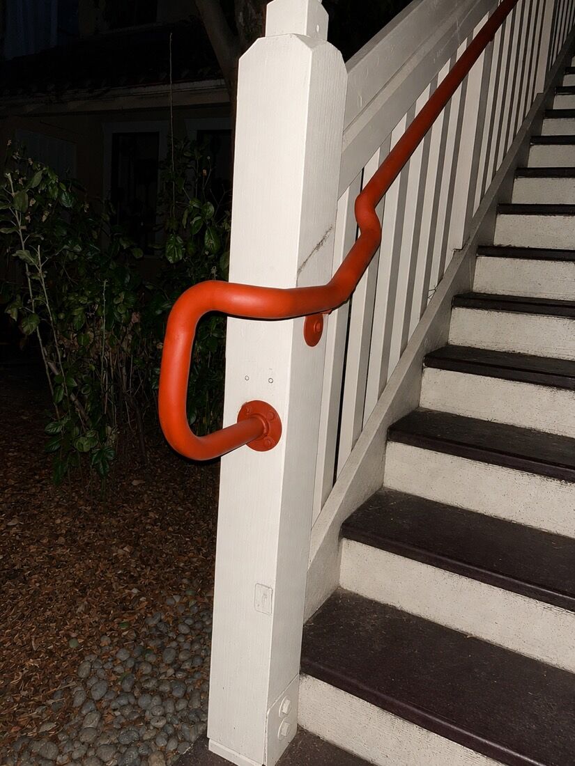 Custom welded steel handrail with a smooth powder-coated finish