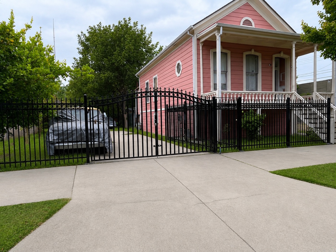 Custom wrought iron driveway gate and fence in Sacramento